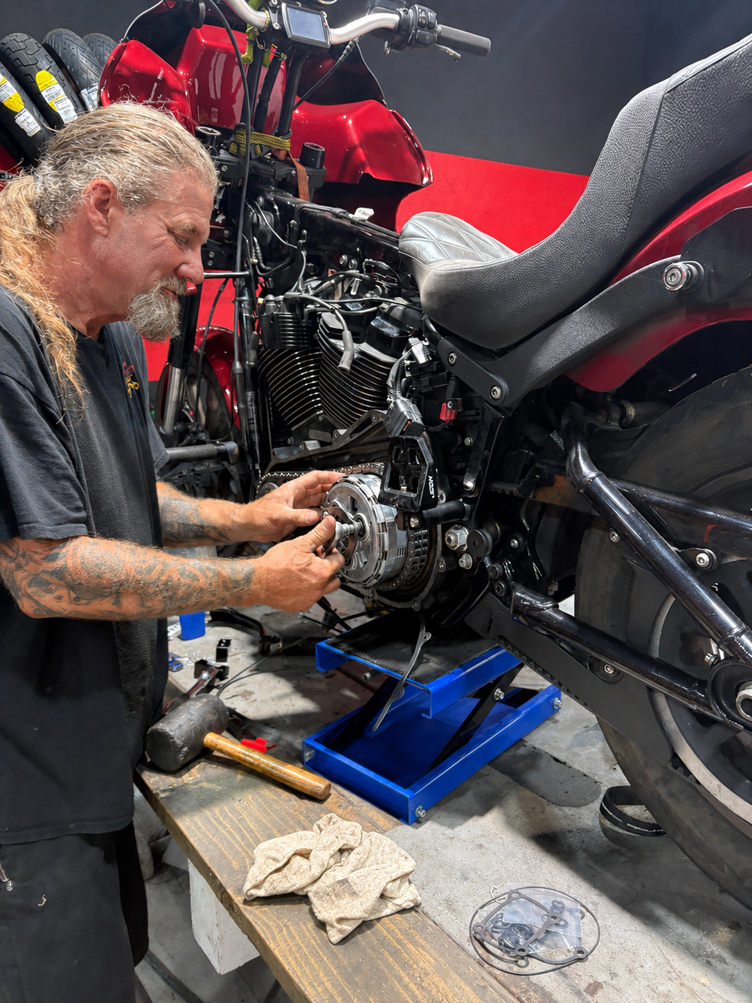 Sean performing hands-on motorcycle maintenance at Rodo's Cycle Center